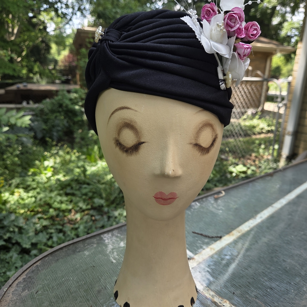 Elegant Black Turban with Pink and White Floral Accents
